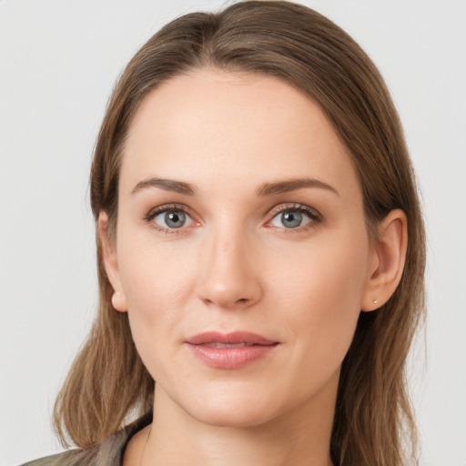 Joyful white young-adult female with long  brown hair and grey eyes