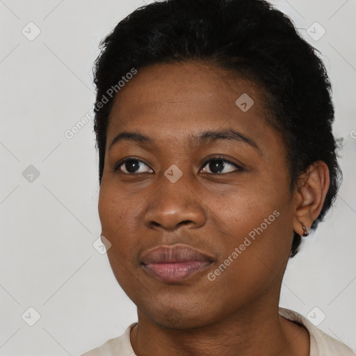 Joyful black young-adult female with short  black hair and brown eyes