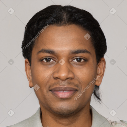 Joyful black young-adult male with short  black hair and brown eyes