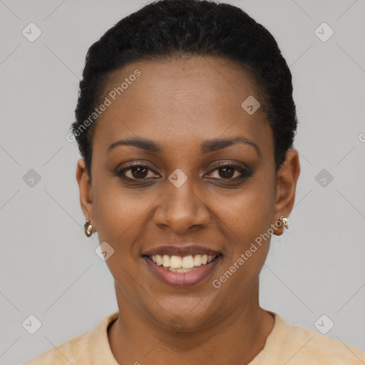 Joyful black young-adult female with short  black hair and brown eyes