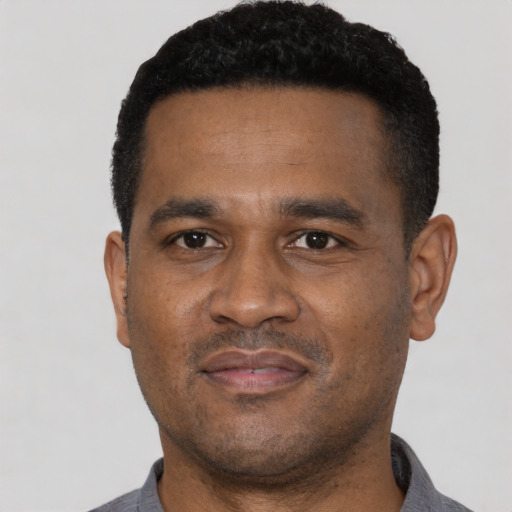 Neutral black young-adult male with short  black hair and brown eyes