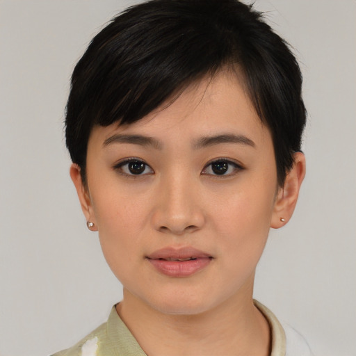 Joyful asian young-adult female with medium  black hair and brown eyes