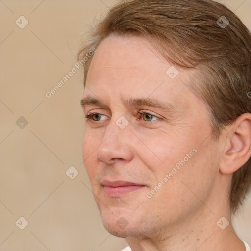 Joyful white adult male with medium  brown hair and brown eyes