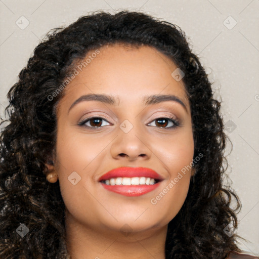 Joyful latino young-adult female with long  brown hair and brown eyes