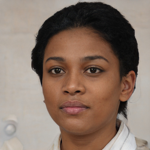 Neutral black young-adult female with short  black hair and brown eyes