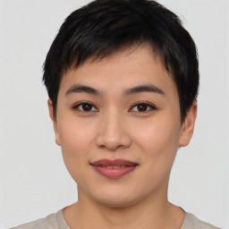 Joyful asian young-adult female with short  black hair and brown eyes