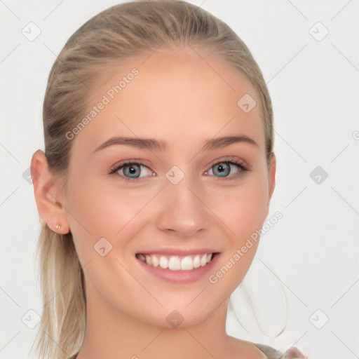 Joyful white young-adult female with long  brown hair and blue eyes