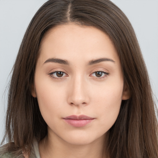 Neutral white young-adult female with long  brown hair and brown eyes