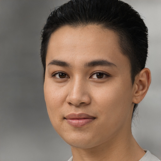Joyful latino young-adult female with short  black hair and brown eyes