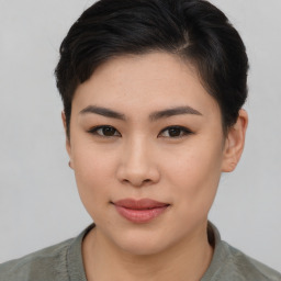 Joyful asian young-adult female with short  brown hair and brown eyes