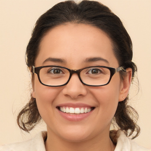 Joyful white young-adult female with medium  brown hair and brown eyes