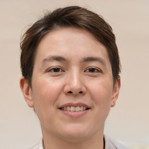 Joyful white adult female with short  brown hair and brown eyes