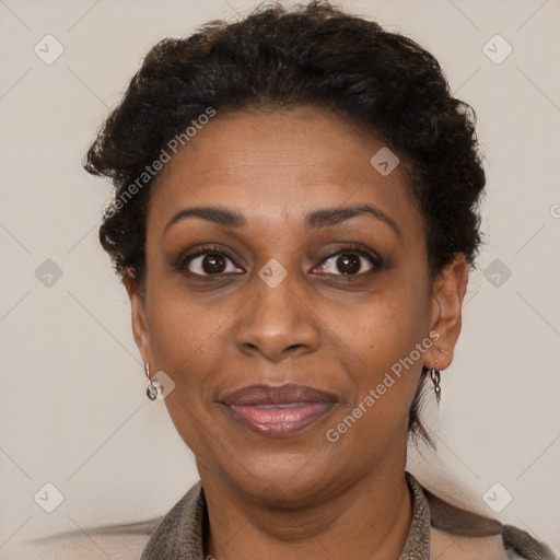 Joyful black adult female with short  brown hair and brown eyes