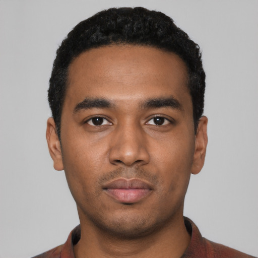 Neutral black young-adult male with short  black hair and brown eyes