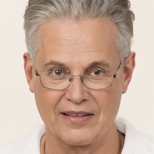 Joyful white middle-aged male with short  gray hair and brown eyes