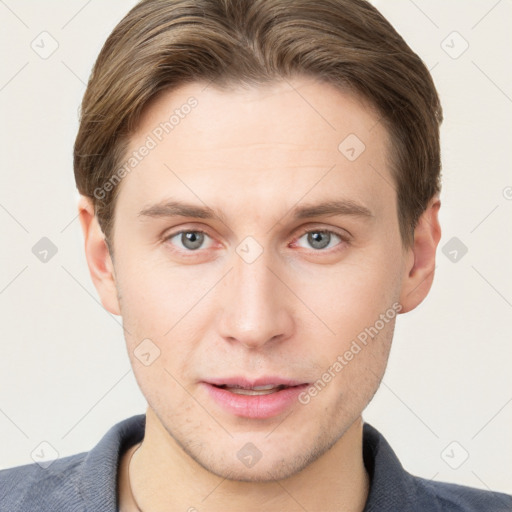 Joyful white young-adult male with short  brown hair and grey eyes