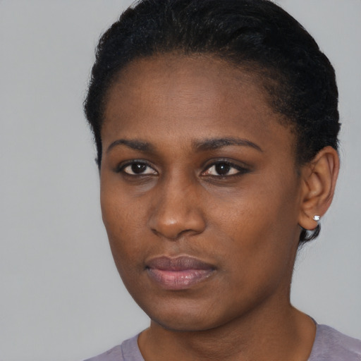 Neutral black young-adult female with short  brown hair and brown eyes