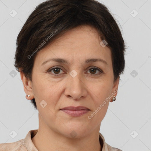 Joyful white adult female with short  brown hair and brown eyes