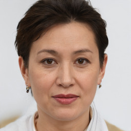 Joyful white adult female with short  brown hair and brown eyes