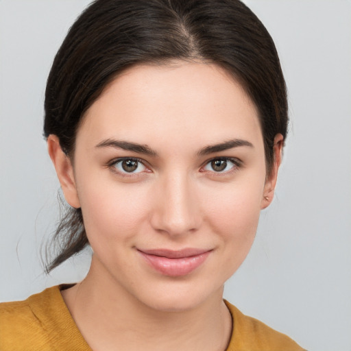 Joyful white young-adult female with medium  brown hair and brown eyes