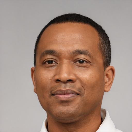Neutral black adult male with short  black hair and brown eyes