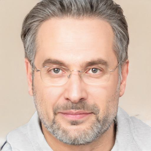 Joyful white middle-aged male with short  brown hair and brown eyes