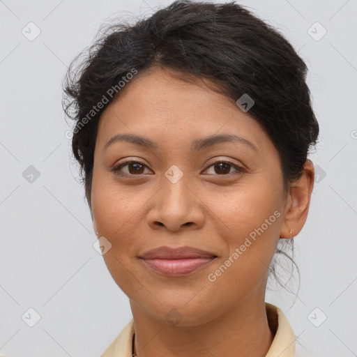 Joyful latino young-adult female with short  brown hair and brown eyes