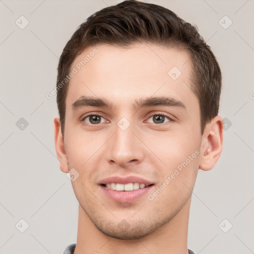 Joyful white young-adult male with short  brown hair and brown eyes