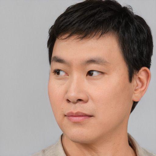 Neutral asian young-adult male with short  black hair and brown eyes