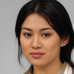 Joyful asian young-adult female with medium  black hair and brown eyes