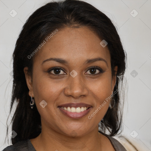 Joyful black adult female with medium  brown hair and brown eyes