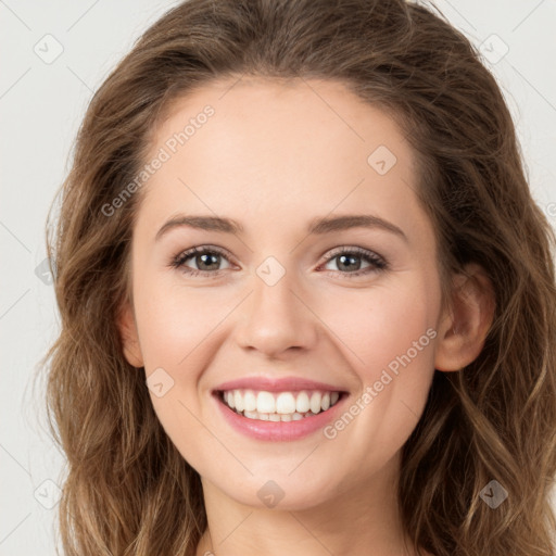 Joyful white young-adult female with long  brown hair and green eyes