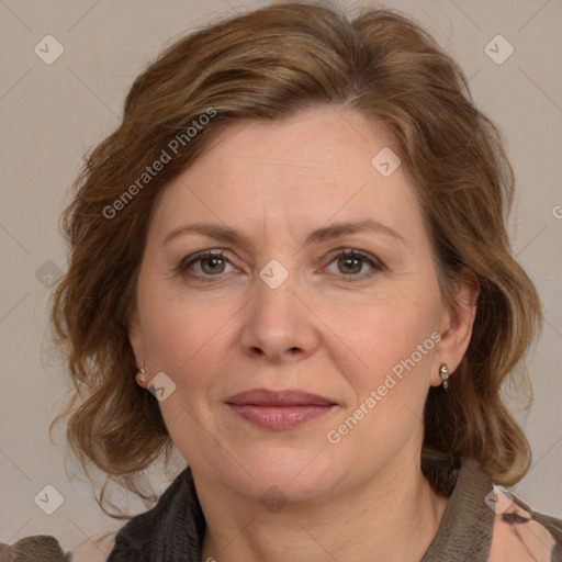 Joyful white adult female with medium  brown hair and brown eyes