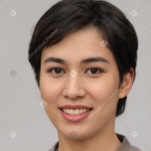 Joyful asian young-adult female with short  brown hair and brown eyes