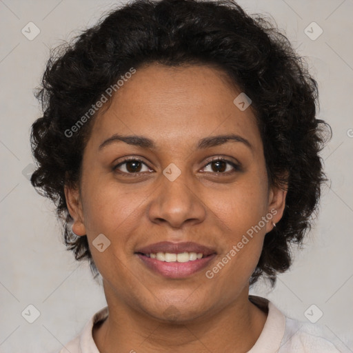 Joyful black adult female with short  brown hair and brown eyes