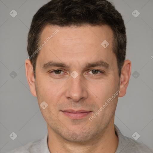 Joyful white adult male with short  brown hair and brown eyes