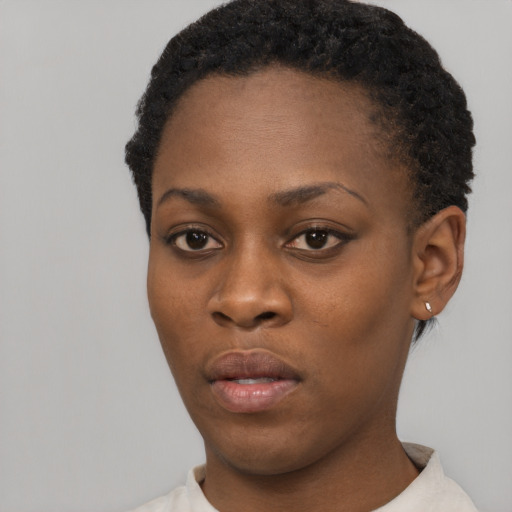 Neutral black young-adult female with short  black hair and brown eyes