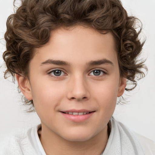 Joyful white child male with medium  brown hair and brown eyes