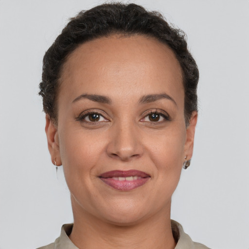 Joyful white adult female with short  brown hair and brown eyes
