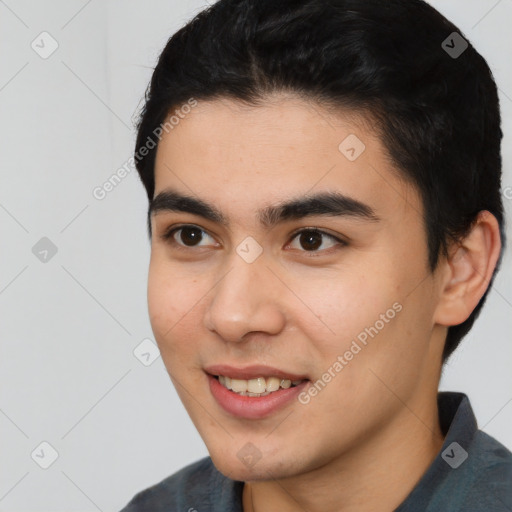 Joyful latino young-adult male with short  black hair and brown eyes