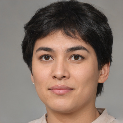 Joyful asian young-adult female with short  brown hair and brown eyes