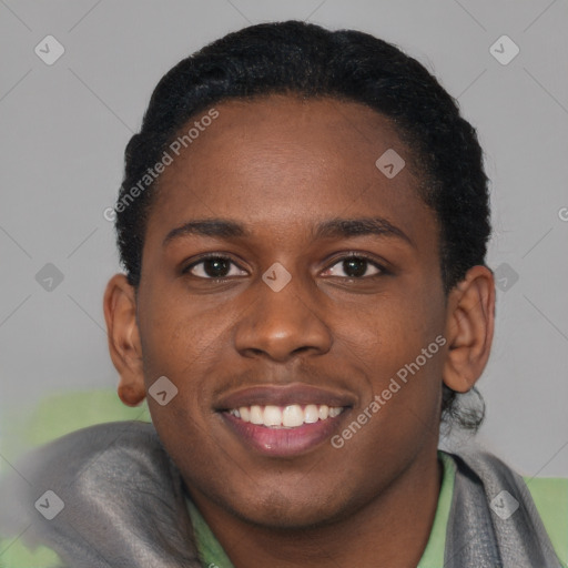 Joyful black young-adult male with short  brown hair and brown eyes