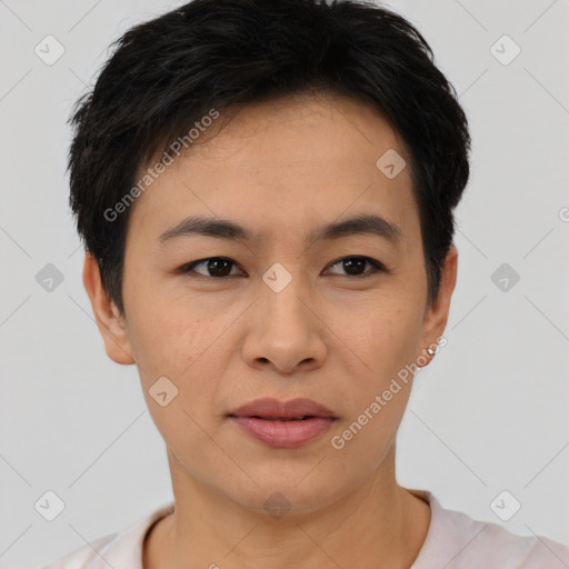 Joyful asian young-adult female with short  black hair and brown eyes