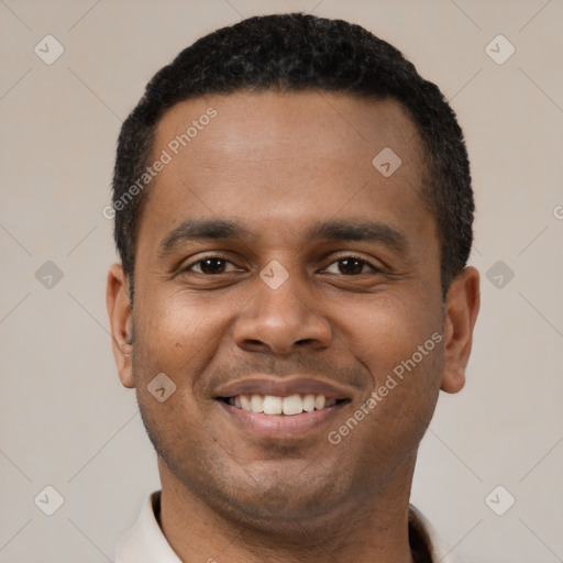 Joyful latino young-adult male with short  black hair and brown eyes