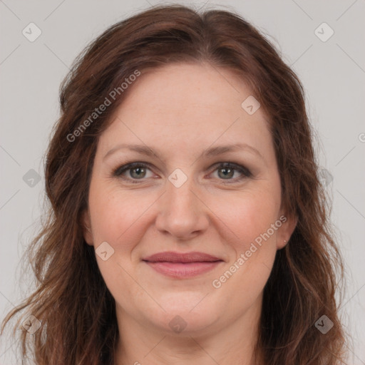 Joyful white adult female with long  brown hair and brown eyes