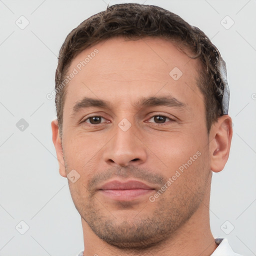 Joyful white young-adult male with short  brown hair and brown eyes