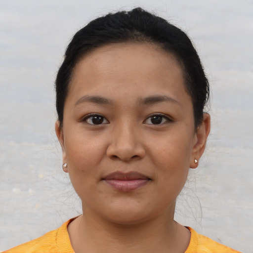 Joyful asian young-adult female with short  brown hair and brown eyes