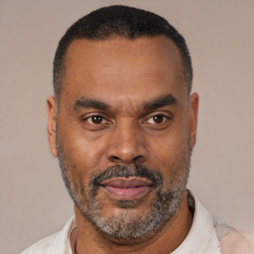 Neutral latino adult male with short  black hair and brown eyes