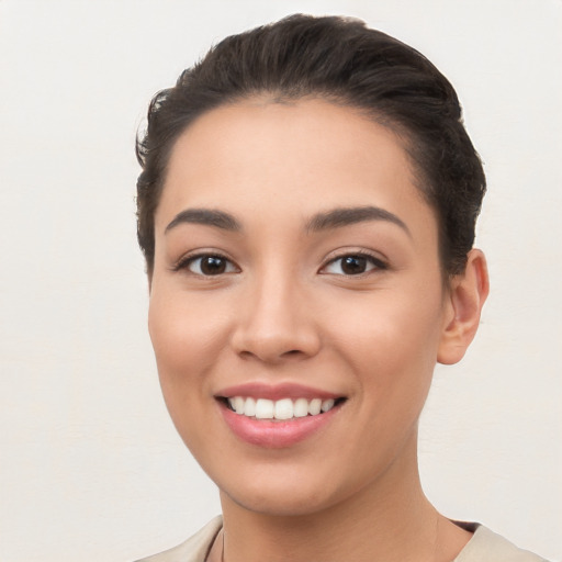 Joyful white young-adult female with short  black hair and brown eyes