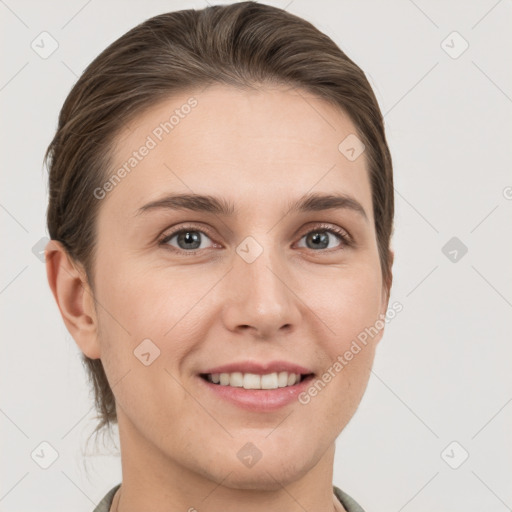 Joyful white young-adult female with short  brown hair and grey eyes